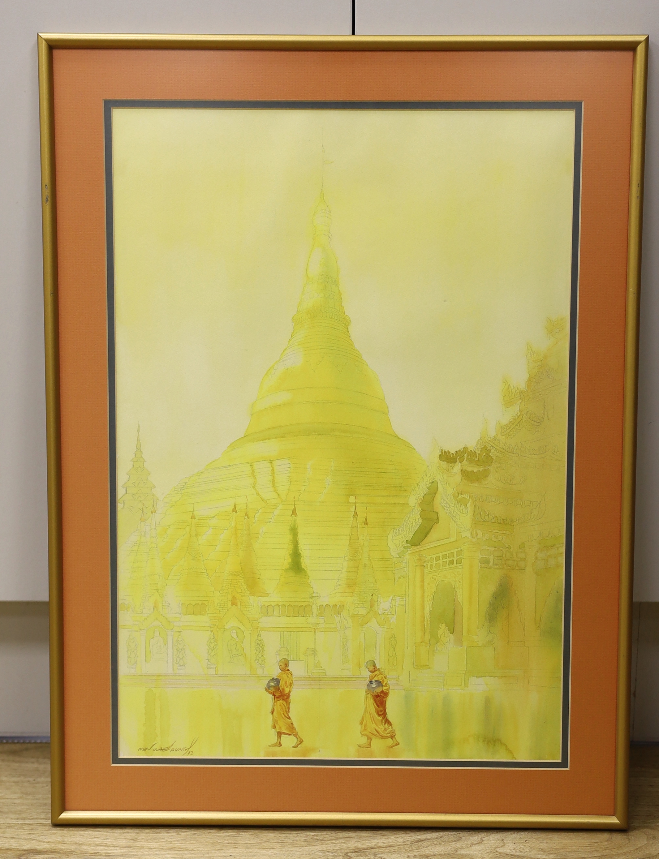 Min Wae Aung, (Burmese, b. 1960-), Two Buddhist monks crossing a precinct before a temple, signed and dated '92, 49 x 34cm